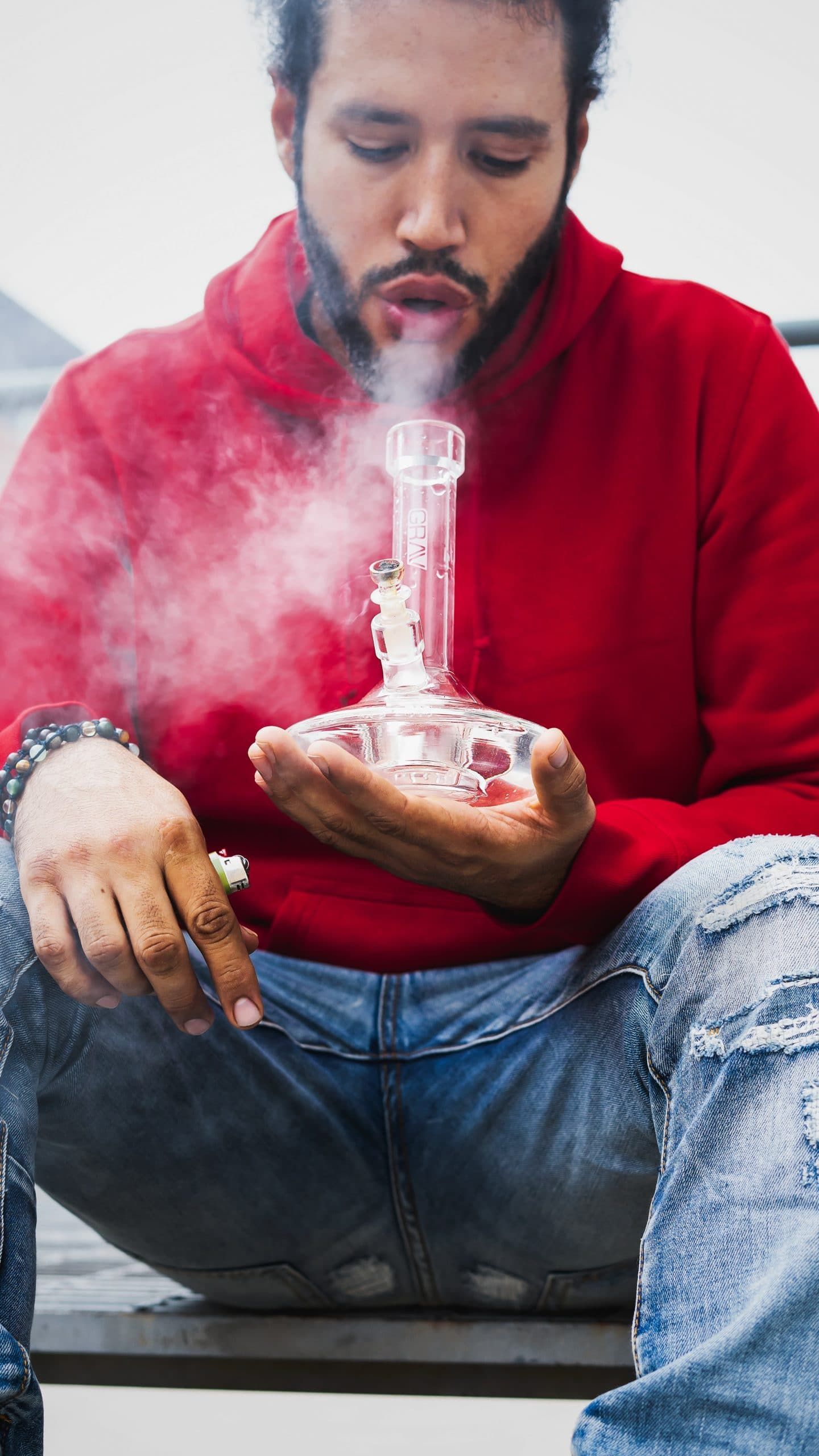 Man smokes weed from a Grav Labs Bong