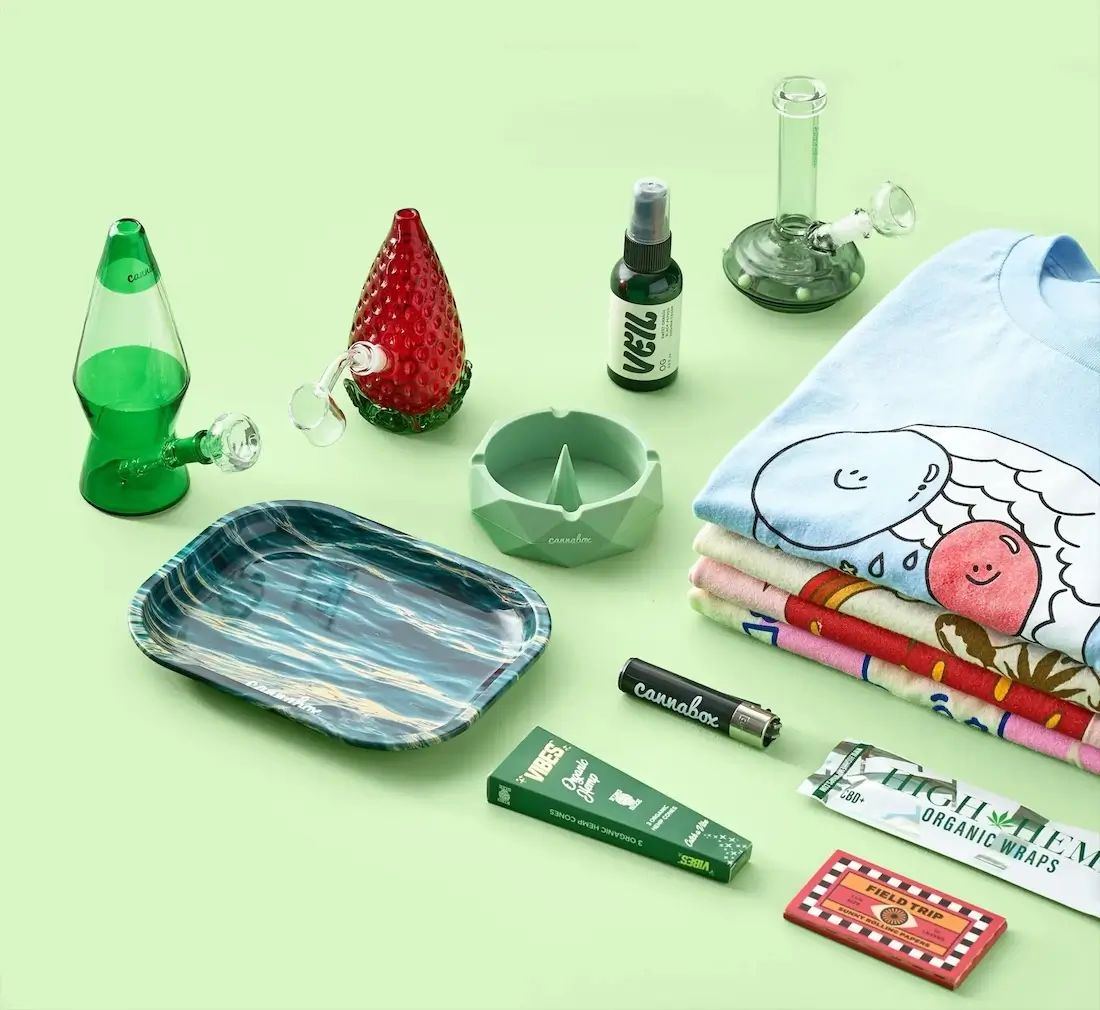 A curated Cannabox weed subscription box with bongs and accessories