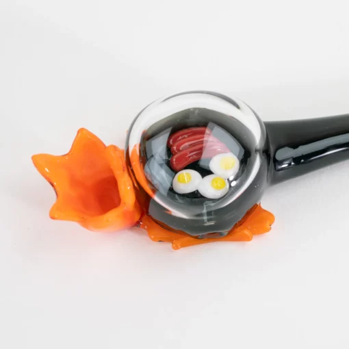 Empire 'Sausage & Eggs' Hand Pipe made from durable borosilicate glass, featuring a playful design that enhances functionality and aesthetics.