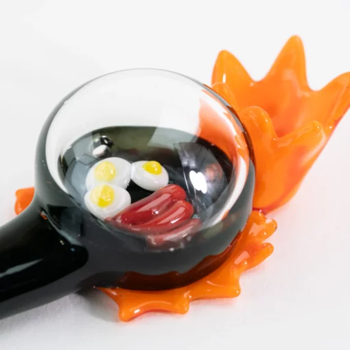 Empire 'Sausage & Eggs' Hand Pipe made from durable borosilicate glass, featuring a playful design that enhances functionality and aesthetics.