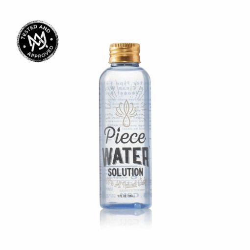 A clear plastic bottle with a gold cap labeled Piece Water Cleaning Solution contains a transparent liquid. A black and white Tested and Approved seal is in the top left corner, all set against a plain white background.