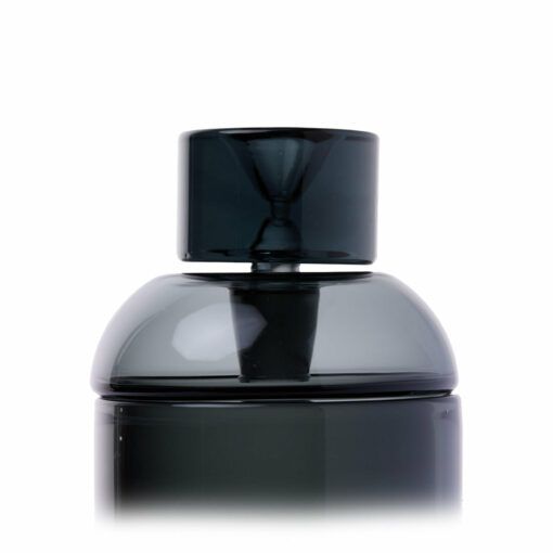 A close-up of the NWTN Home Vesper Gravity Pipe, a sleek, dark, glossy cylindrical piece with a matching rounded cap, set against a plain white background. The modern design highlights its contemporary appeal.
