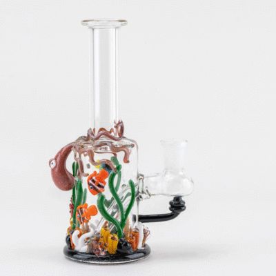 The Empire Glassworks Under the Sea Mini Rig is a clear glass piece adorned with colorful sea creatures, including an octopus, clownfish, seaweed, and coral on a plain white background.