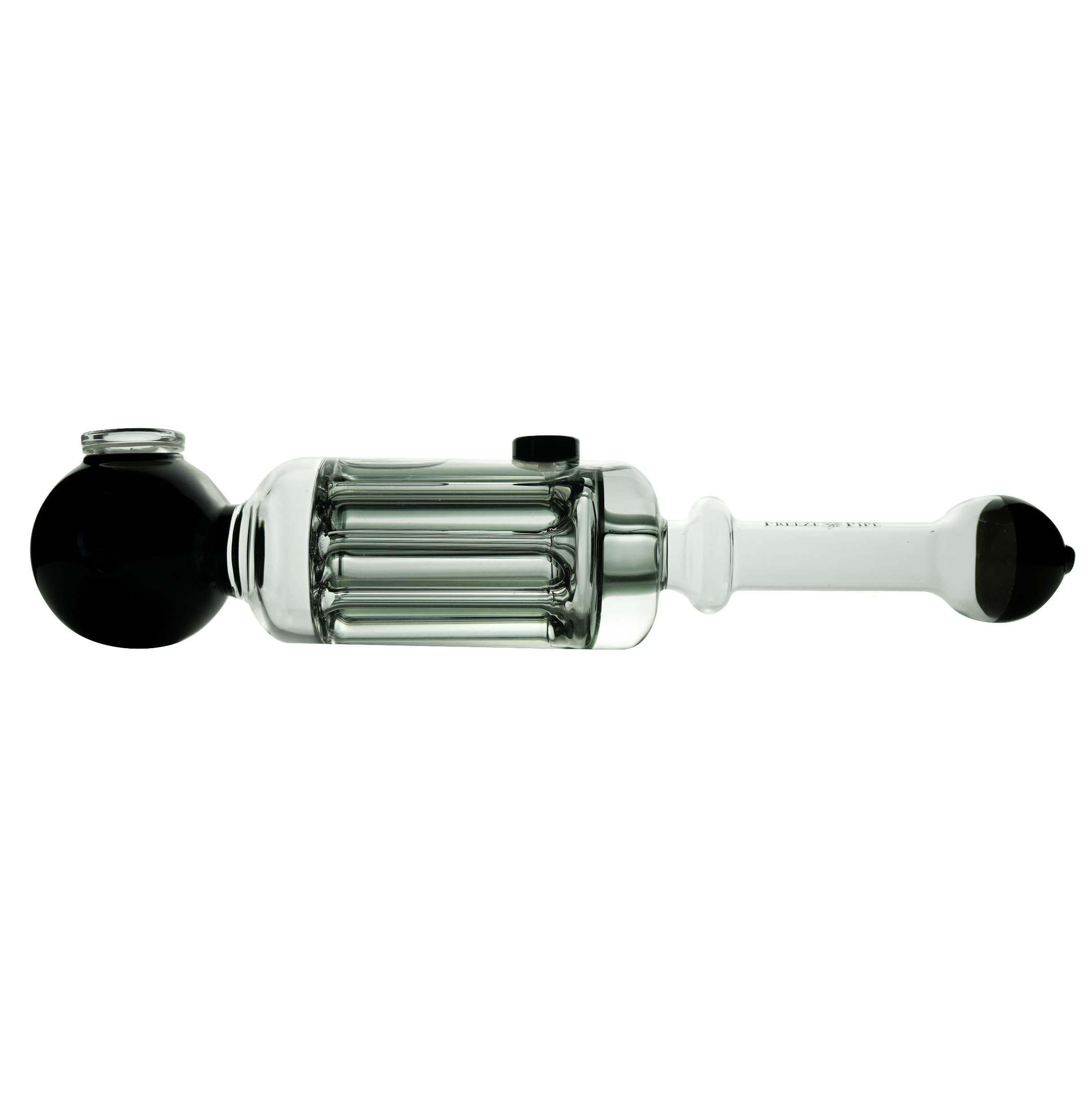 The Freeze Pipe Steamroller is a clear glass smoking pipe with black accents, featuring a cylindrical chamber with multiple vertical tubes, a round bowl at one end, and a mouthpiece on the other for a unique, stylish experience.