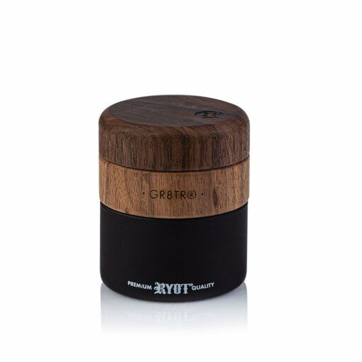 The WOOD GR8TR WITH JAR BODY is a cylindrical wood grinder featuring a wooden top labeled GR8TR and a black base marked RYOT PREMIUM QUALITY, displayed against a white background.