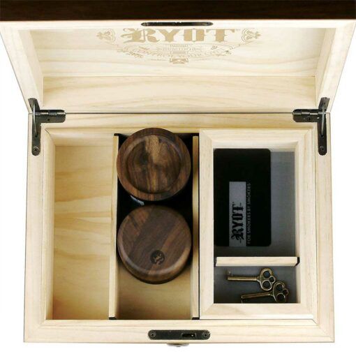 The HUMIDOR WALNUT COMBO BOX (8X11) features compartments with two round wooden containers, a black card, a metal tool, and two antique-style keys in an engraved walnut box—ideal for elegant cigar storage or a stylish humidor.
