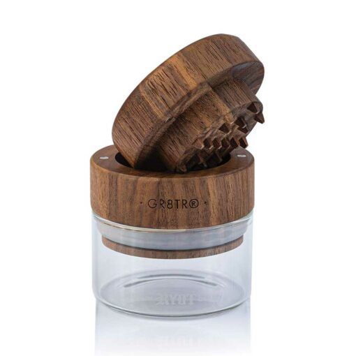 The WOOD GR8TR WITH JAR BODY features "GR8TR" engraved on its wooden lid, a clear jar-shaped base, and sharp grinding teeth—combining classic wood style with modern convenience.