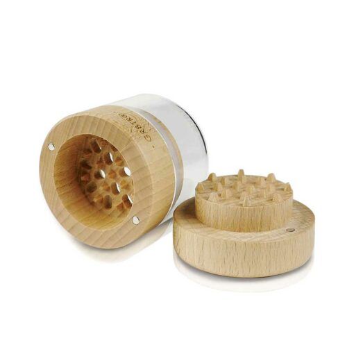 The WOOD GR8TR WITH JAR BODY features a unique GR8TR design—one part stands upright showing sharp teeth, while the other lies flat to display its spiked surface.