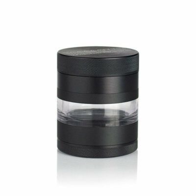The RYOT 4PC JAR BODY GRINDER is a black cylindrical grinder with a transparent middle section, made of plastic and metal, shown standing upright on a white background.