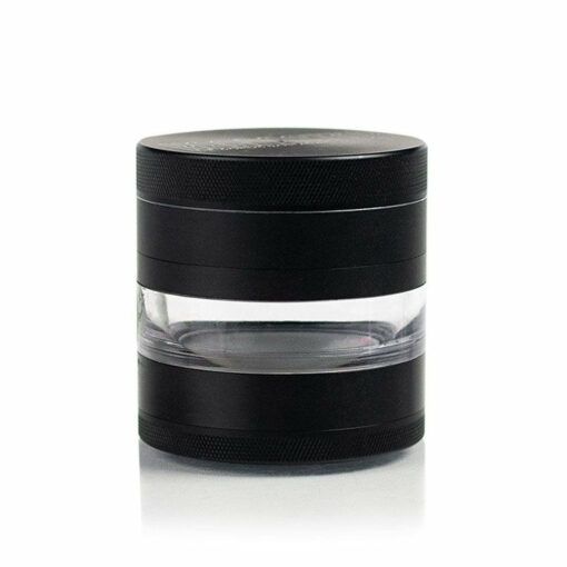 The RYOT 4PC JAR BODY GRINDER is a black and transparent cylindrical container with a screw-top lid, featuring a clear middle section that reveals the interior, all displayed against a plain white background.