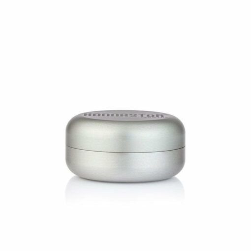 The RYOT GR8TR JAR BODY GRINDER is a small, round, silver metal grinder with a smooth finish and flush lid, displayed against a white background.