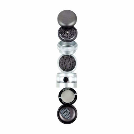 A vertically arranged, disassembled RYOT GR8TR JAR BODY GRINDER displays its black and silver lid, grinding teeth, mesh screen, and pollen catcher in a column against a white background.