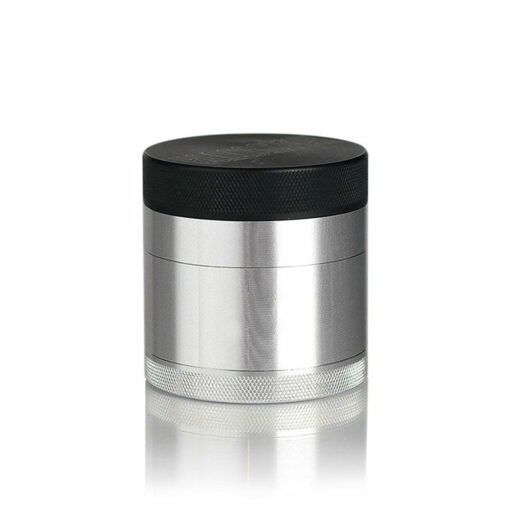 A silver cylindrical RYOT 4PC SOLID BODY GRINDER with a black textured screw-on lid and a textured grip pattern at the base, displayed against a white background.