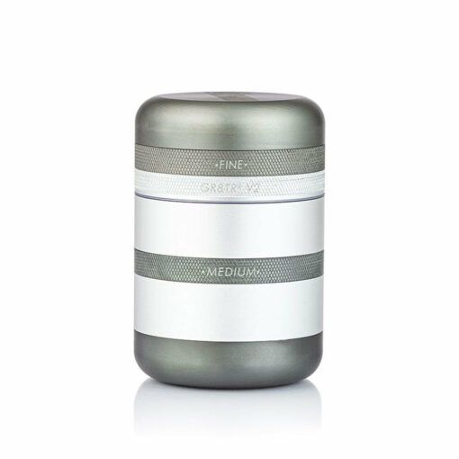 The RYOT GR8TR SOLID BODY GRINDER is a cylindrical metallic grinder featuring two labeled bands—FINE on the upper band and MEDIUM on the lower—shown against a white background.