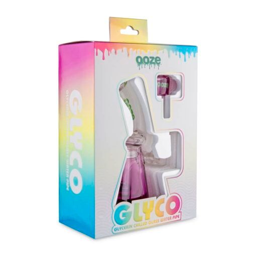 A vibrant gradient box labeled Ooze showcases the Ooze Glyco Bong Glycerin Chilled Glass Water Pipe, with the pipe visible through a window on the packaging.