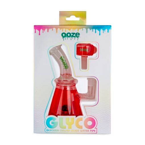 A packaged Ooze Glyco Bong Glycerin Chilled Glass Water Pipe in red, visible through a clear window in its colorful branded box, with the product name and description displayed at the bottom.
