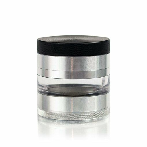 A silver and clear RYOT 4PC JAR BODY GRINDERS with a black screw-on lid is displayed on a white background. Made of metal and plastic, it's ideal for storing herbs or using alongside grinders.