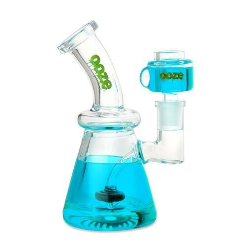 The Ooze Glyco Bong Glycerin Chilled Glass Water Pipe features clear glass with blue glycerin, a slanted neck, attached chamber, and the green Ooze logo for smooth, chilled hits.