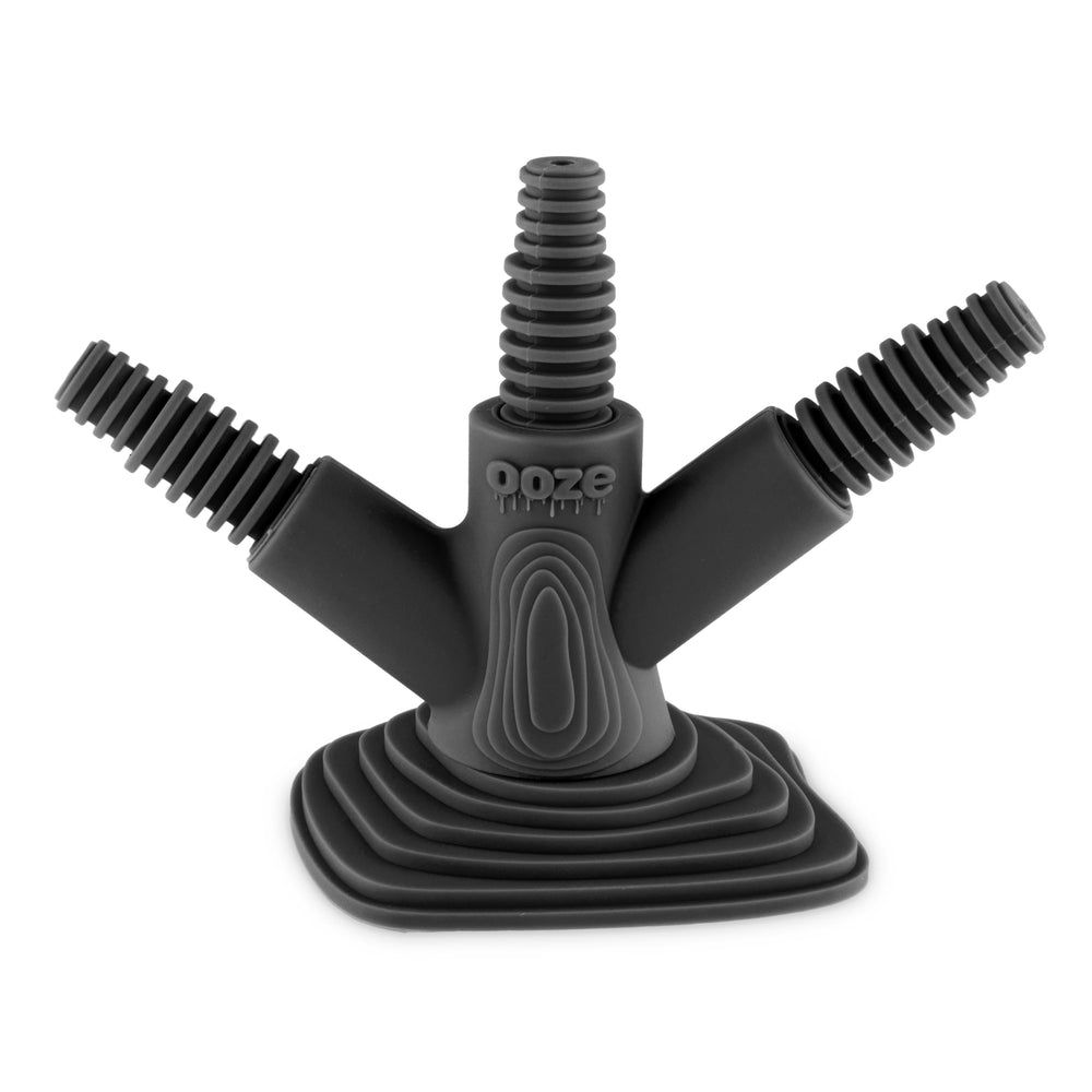 The Ooze Banger Hanger Silicone Banger Stand features a black, three-armed silicone design with ribbed mouthpieces, a square layered base, and embossed ooze branding for both style and function.