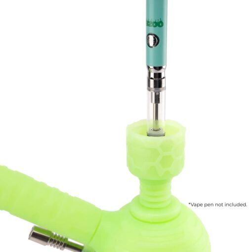 The Ooze Blaster Silicone Glass 4-in-1 Hybrid Water Pipe and Dab Straw, shown in green with a honeycomb-patterned joint, holds a blue vape pen. Text in the corner reads: Vape pen not included.