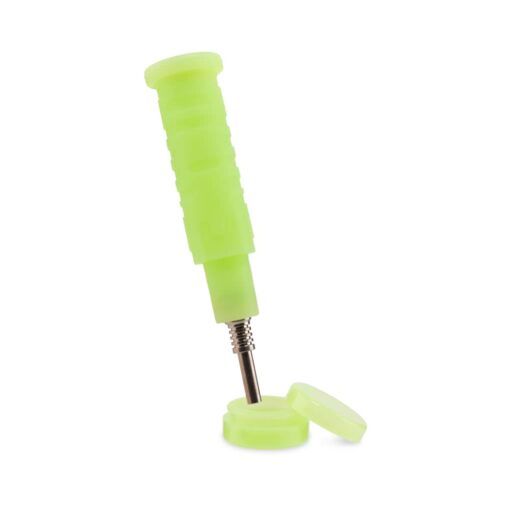 A green pill crusher with a ribbed handle and two round compartments, shown on a white background, features a compact design similar to the Ooze Blaster Silicone Glass 4-in-1 Hybrid Water Pipe and Dab Straw.
