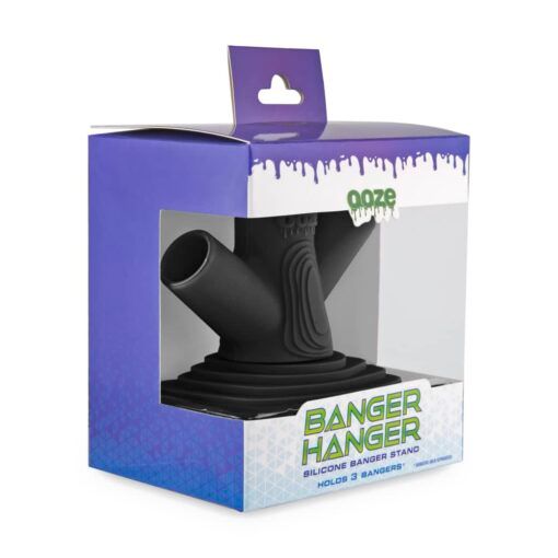 The Ooze Banger Hanger Silicone Banger Stand in black is shown inside a purple and white retail box. The packaging highlights that the stand can securely hold 3 bangers.