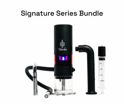 A black electronic device labeled Trident V3, featuring attached hoses, a glass base, a curved black tube, and a clear syringe, displayed under the text Signature Series Bundle on a white background.