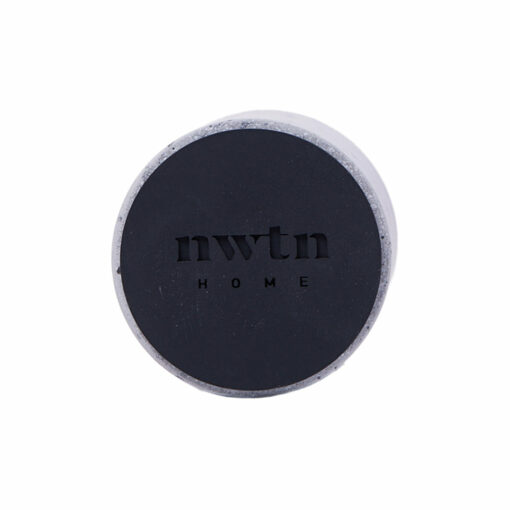 The NWTN Home Anchor Lighter Holder features a round design with a black top, "NWTN" and "HOME" engraved at the center, and a stone-like outer edge shown on a plain white background.