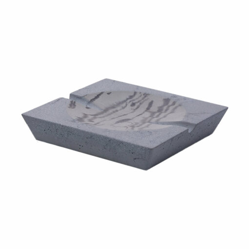 The NWTN Home Roseland Set Ashtray is rectangular, dark gray concrete with a smooth, shallow circular depression, a cigarette notch, and a slightly speckled surface.