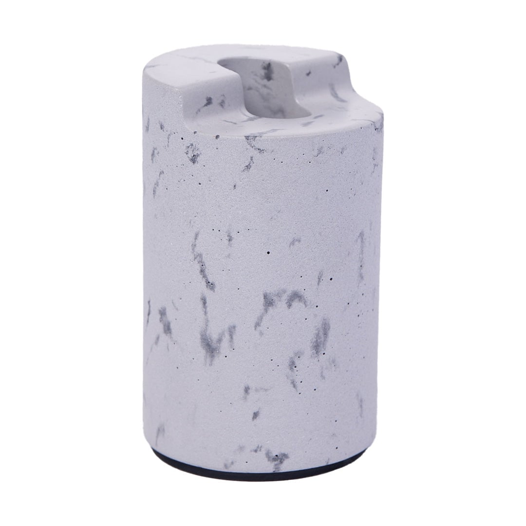 A cylindrical, light gray NWTN Home object with a marbled pattern and a rounded groove on top, resembling a minimalist concrete lighter holder or desk organizer, set against a white background.