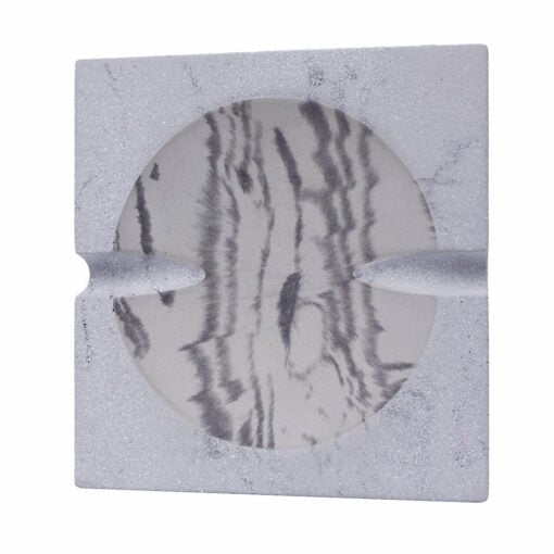 The NWTN Home Roseland Set Ashtray is a square, light gray ashtray with a textured finish, featuring a round marbled black and white inner surface and two grooves for cigarettes.