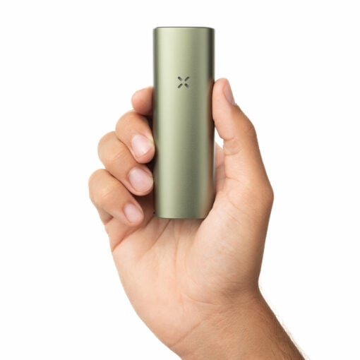 A hand holds a sleek Pax Four Vaporizer in metallic green, featuring an X-shaped LED indicator on the front, set against a plain white background.