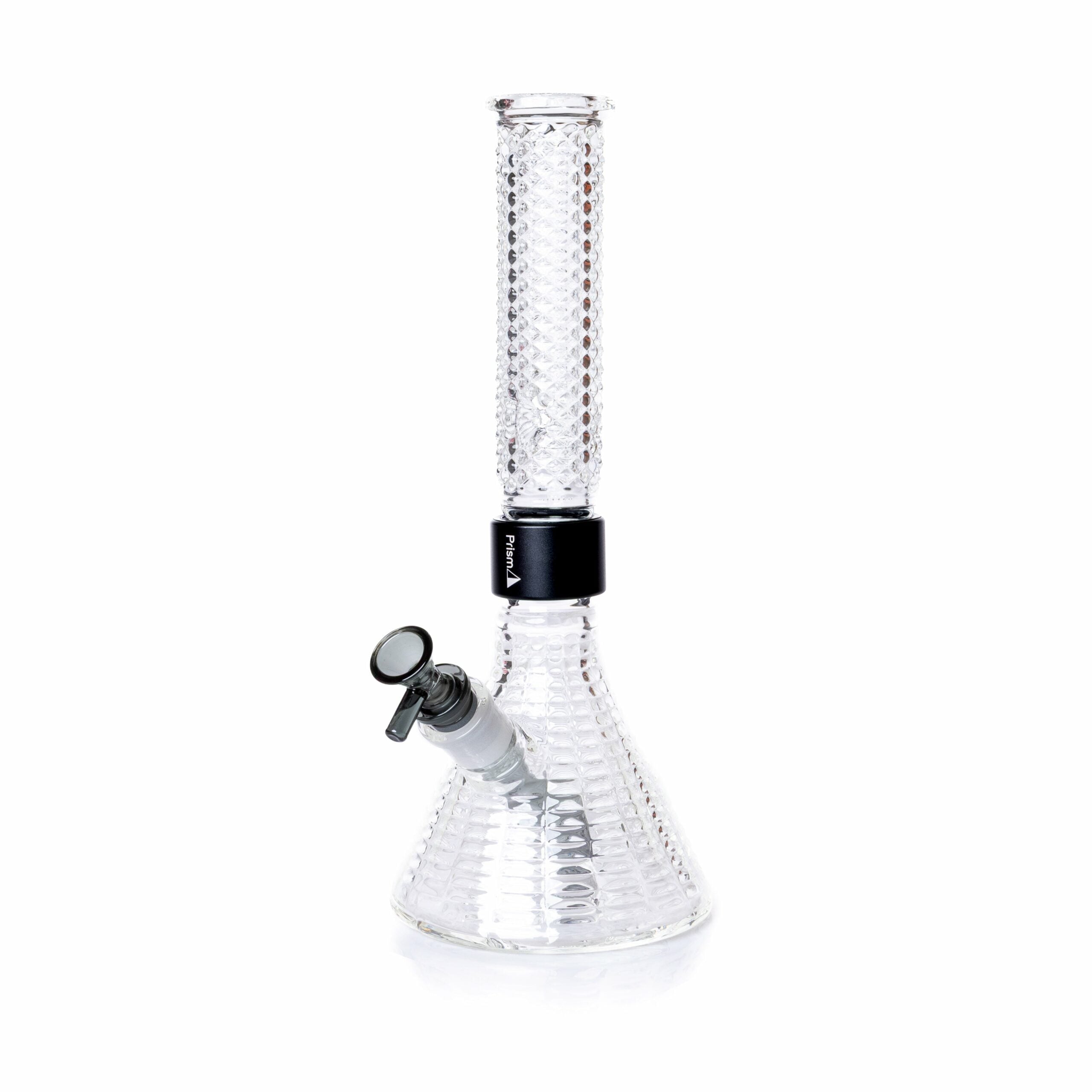 The Jane West x Prism Bong - Clear features a beaker shape, textured surface, straight neck, and a black band around the joint. It includes a removable bowl and downstem near the base, all in Jane West’s signature style.