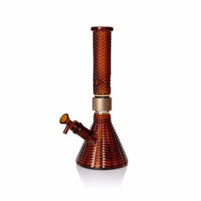An amber Jane West x Prism Bong with a cylindrical neck, wide beaker base, and side-mounted bowl is photographed on a white background.