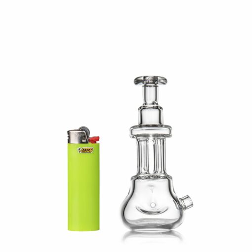 The MJ Arsenal Tetra mini water pipe with beaker base stands upright beside a yellow-green Bic lighter on a white background.