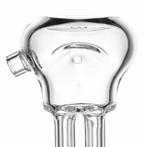 Close-up of the MJ Arsenal Tetra dab rig, featuring a clear glass body with a rounded top, small side spout, central hole, and vertical tubes. Photographed on a white background.