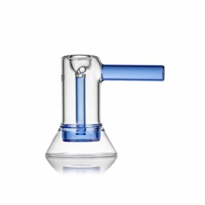 The MJ Arsenal Cove Glass Bubbler is a clear glass beaker with a conical base, blue cylindrical handle, and inner tube, displayed against a white background.