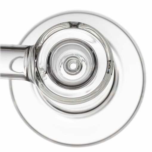 A top-down view of the MJ Arsenal Cove Glass Bubbler shows its clear, circular design with concentric rings, plus a handle or tube extending from the side, all set against a white background.