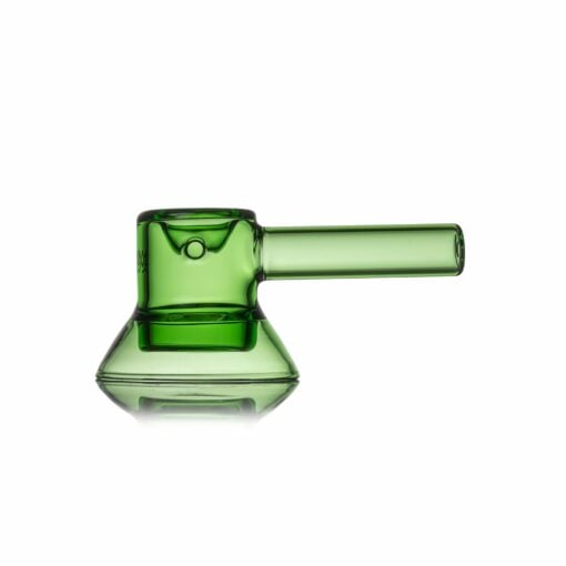 The MJ Arsenal Grotto Glass Pipe is a transparent green piece featuring a cylindrical mouthpiece, rounded chamber, and flat wide base, shown on a white background with a subtle reflection.
