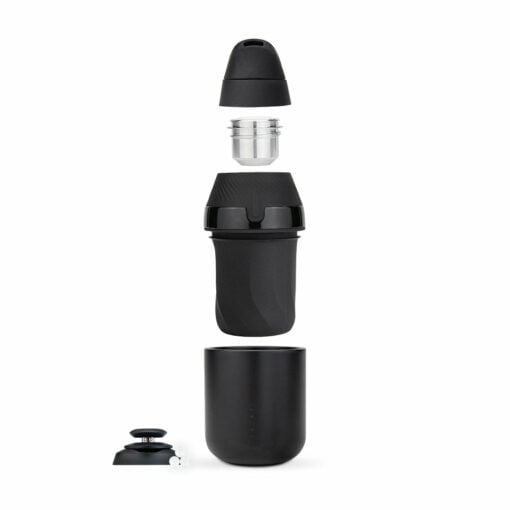 The Puffco Proxy Core Kit, shown in black, features its components—lid, filter, main chamber, travel cup, and a buttoned round part—neatly separated and arranged vertically on a white background.