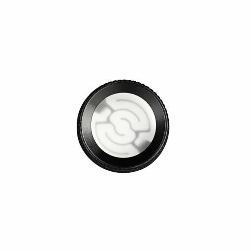 A round, black camera lens filter with a frosted glass center and abstract curved lines, inspired by the sleek design of the Pulsar RöK Electric Dab Rig - Luna Glow, photographed on a plain white background.