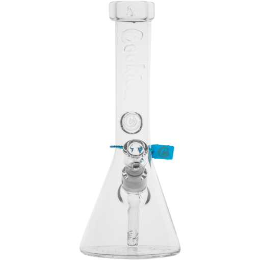 The Cookies Flame Beaker Bong is a clear glass bong featuring "Cookies" embossed vertically on the neck, a removable downstem, and a blue tag attached to the side.