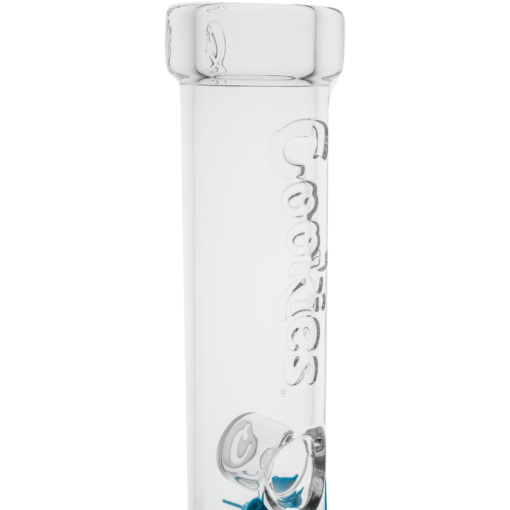 Close-up of the Cookies Flame Beaker Bong—a clear glass, beaker-shaped bong with "Cookies" embossed vertically and a subtle blue hue at the base that catches the light like a gentle flame.