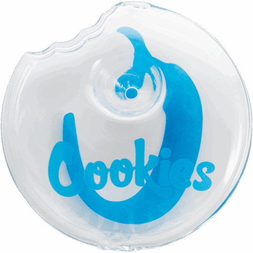 The Cookies Bite Pipe is a clear round pipe with a blue Cookies graphic, a distinct bite mark on the top left edge, and a small circular indentation near the center.