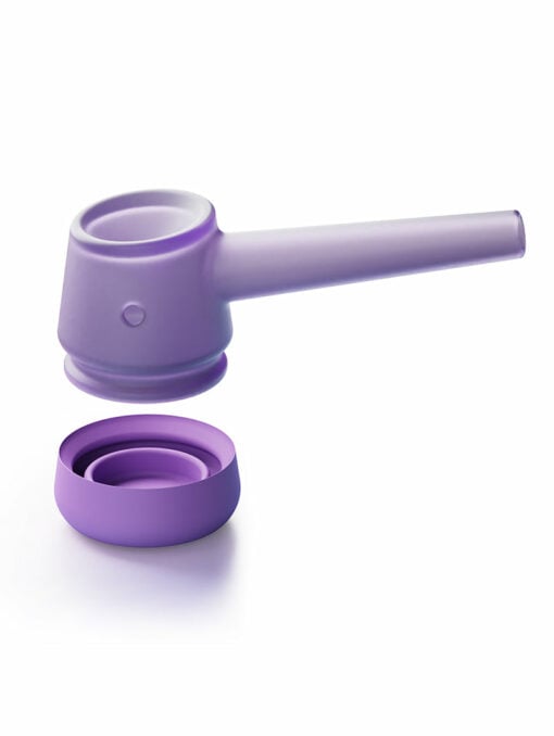 The Forge [Lilac] is a modern glass pipe with a cylindrical bowl and matching round lid, presented on a white background. Its sleek, minimalist design offers a stylish contemporary look.