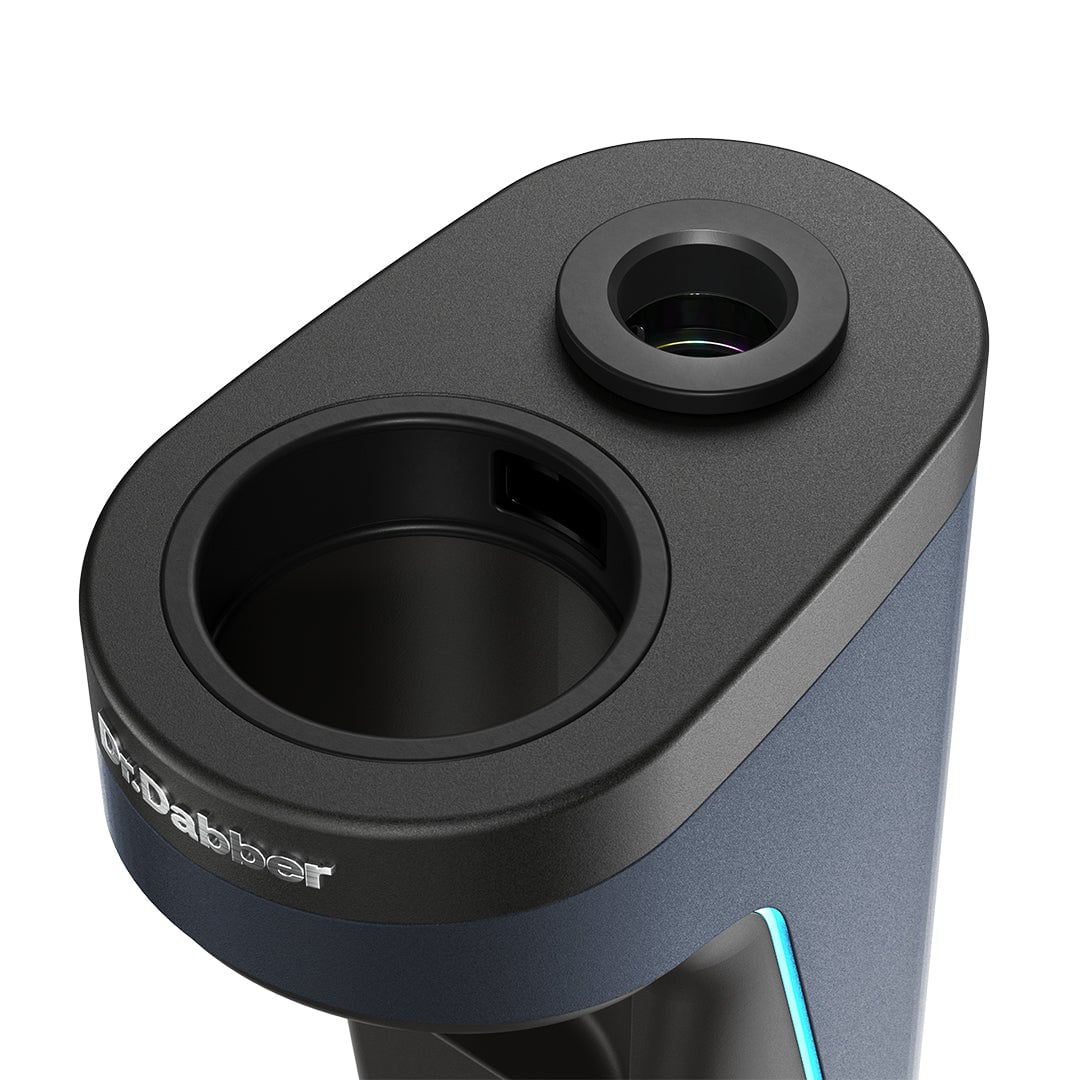 A close-up of the sleek Dr Dabber Switch 2 device shows two circular openings on top and the Dr. Dabber logo, highlighting its modern design for vaporizing concentrates.