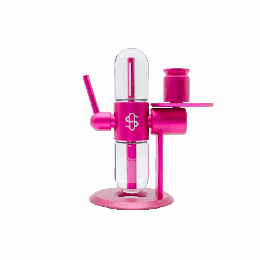 A modern Stündenglass Kompact Gravity Infuser - Pink features transparent glass chambers, a cylindrical body, and a side-mounted cup on a round base, shown against a plain white background.