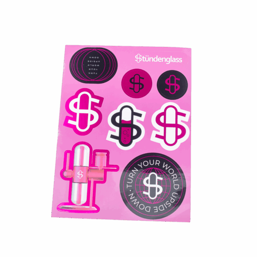 A pink sheet of Stündenglass stickers featuring dollar sign logos, circles with text, and an illustration of the Stündenglass Kompact Gravity Infuser - Pink.