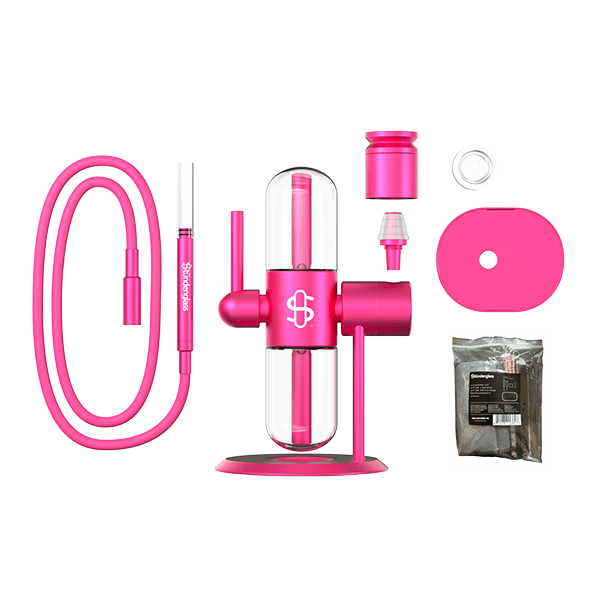 The Pink Stündenglass Kompact Gravity Infuser set includes a hose, mouthpiece, base, glass chamber, bowl, charcoal holder, and charcoal packet—arranged on a white background for stylish occasions.