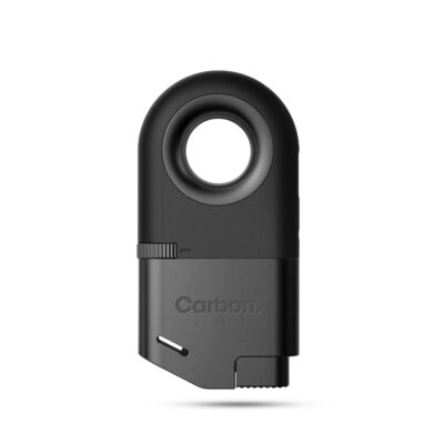 The Carbon lighter features a sleek black design with a circular hole at the top, a textured side adjustment wheel, "Carbon" engraved on the front, and a small ignition button at the bottom right.